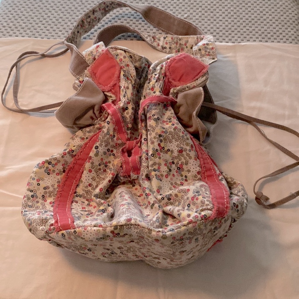 Thirty-one flowered draw string cloth purse. About 14”x14”. 6” bottom